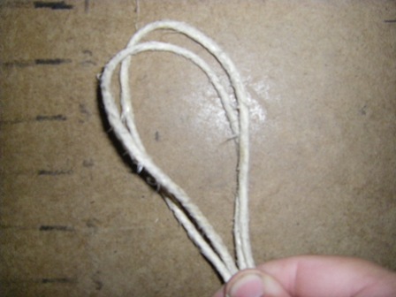 1)  Cut two lengths of hemp cord about three feet long.  Fold the length of hemp cord in half and hold both cords together to form a loop.